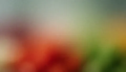 Arrière-plan abstrait avec des couleurs vibrantes qui changent doucement de tons rouges, verts et jaunes.