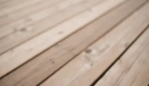 Arrière-plan texturé en bois avec des tons chauds et naturels, idéal pour un design intérieur ou une présentation de meubles.