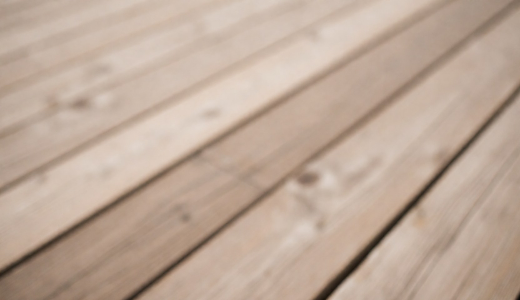 Arrière-plan texturé en bois avec des tons chauds et naturels, idéal pour un design intérieur ou une présentation de meubles.