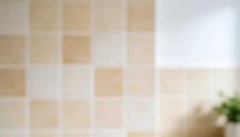 Arrière-plan de cuisine avec carreaux et tons chauds, flouté pour servir de fond à des textes ou bannières promotionnelles.
