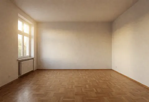 Pièce vide aux murs blancs et au sol en parquet clair, baignée de lumière naturelle par une fenêtre. Idéal pour projets de rénovation ou déménagement.