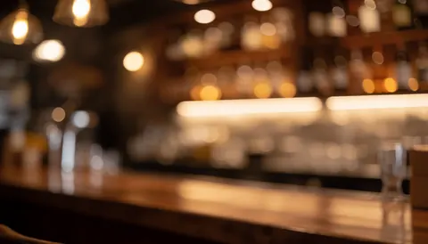 Arrière-plan flou avec des lumières chaudes et un effet bokeh, idéal pour ajouter du texte promotionnel ou publicitaire dans un contexte de bar ou de restaurant.