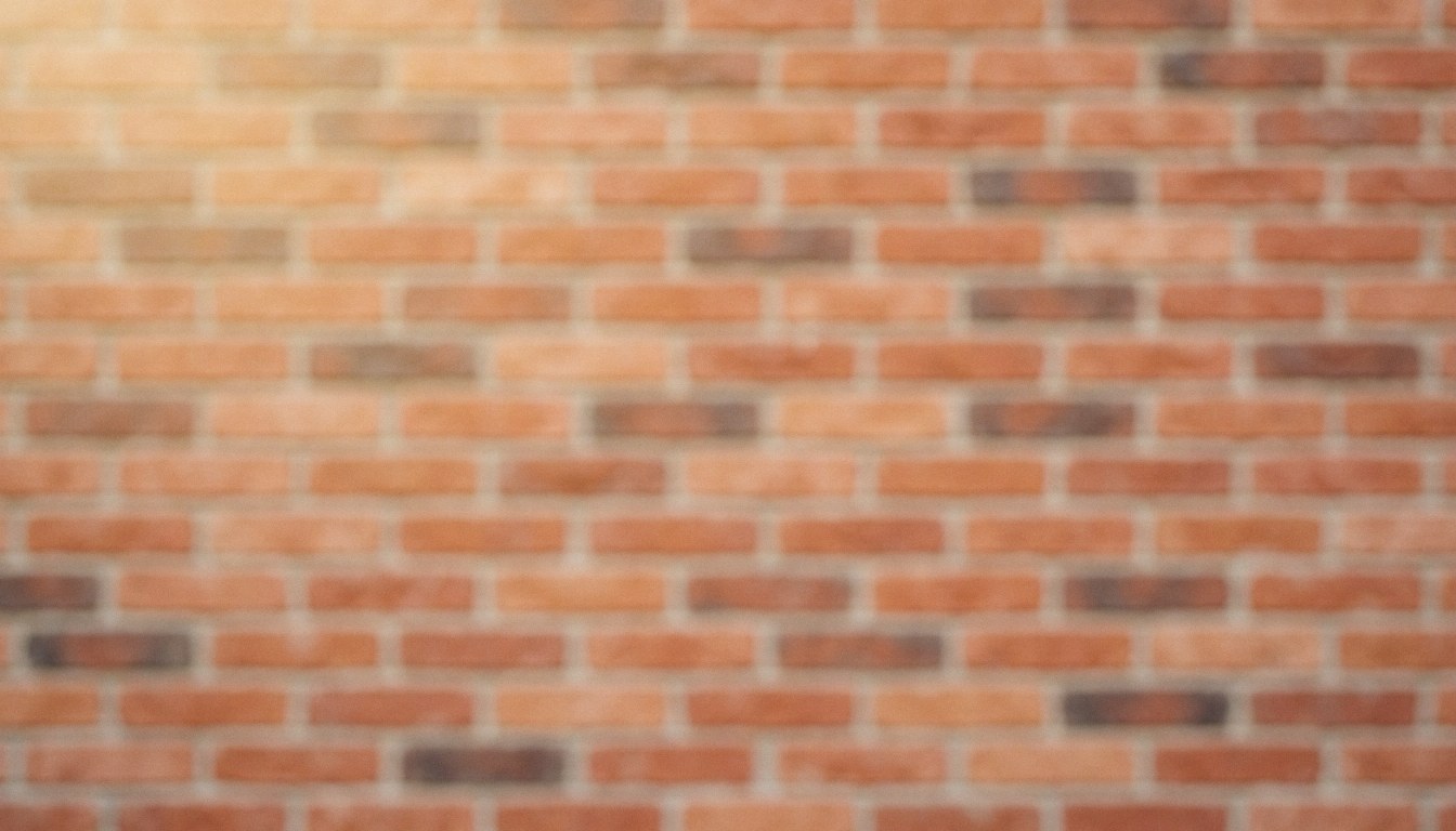 Mur de briques aux teintes chaudes servant de fond neutre pour textes ou publicités, sans personnes ni objets visibles.