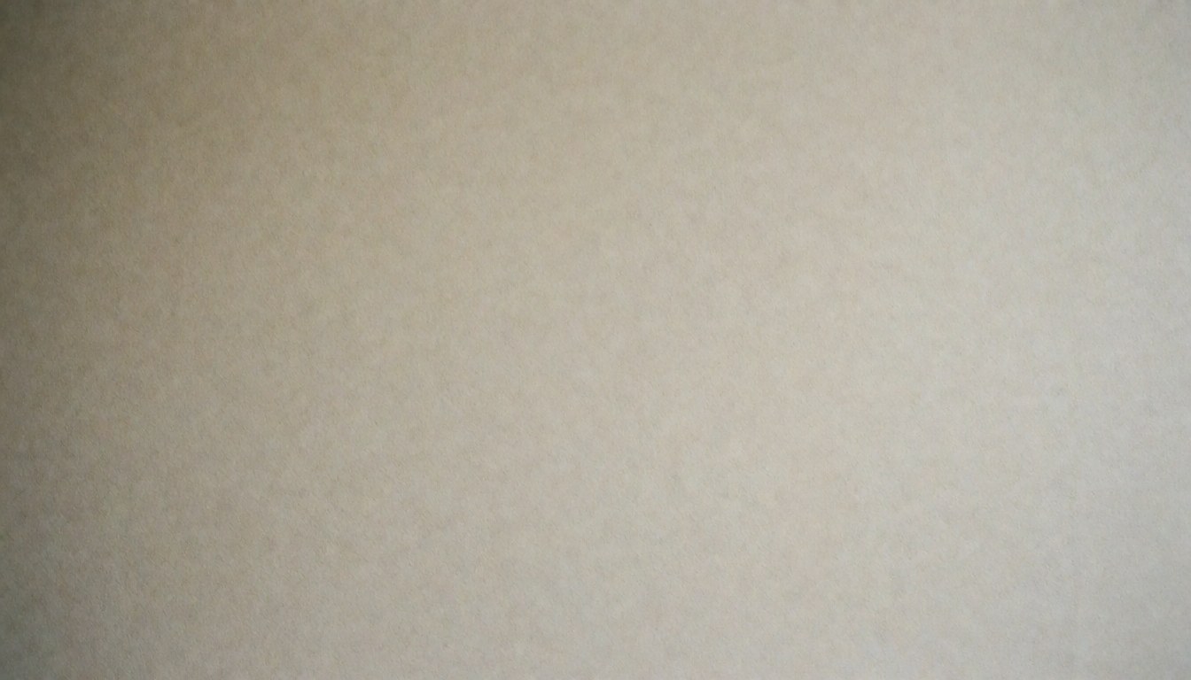Surface murale lisse et uniforme de couleur beige, offrant un arrière-plan neutre et professionnel adapté à l'ajout de textes informatifs.