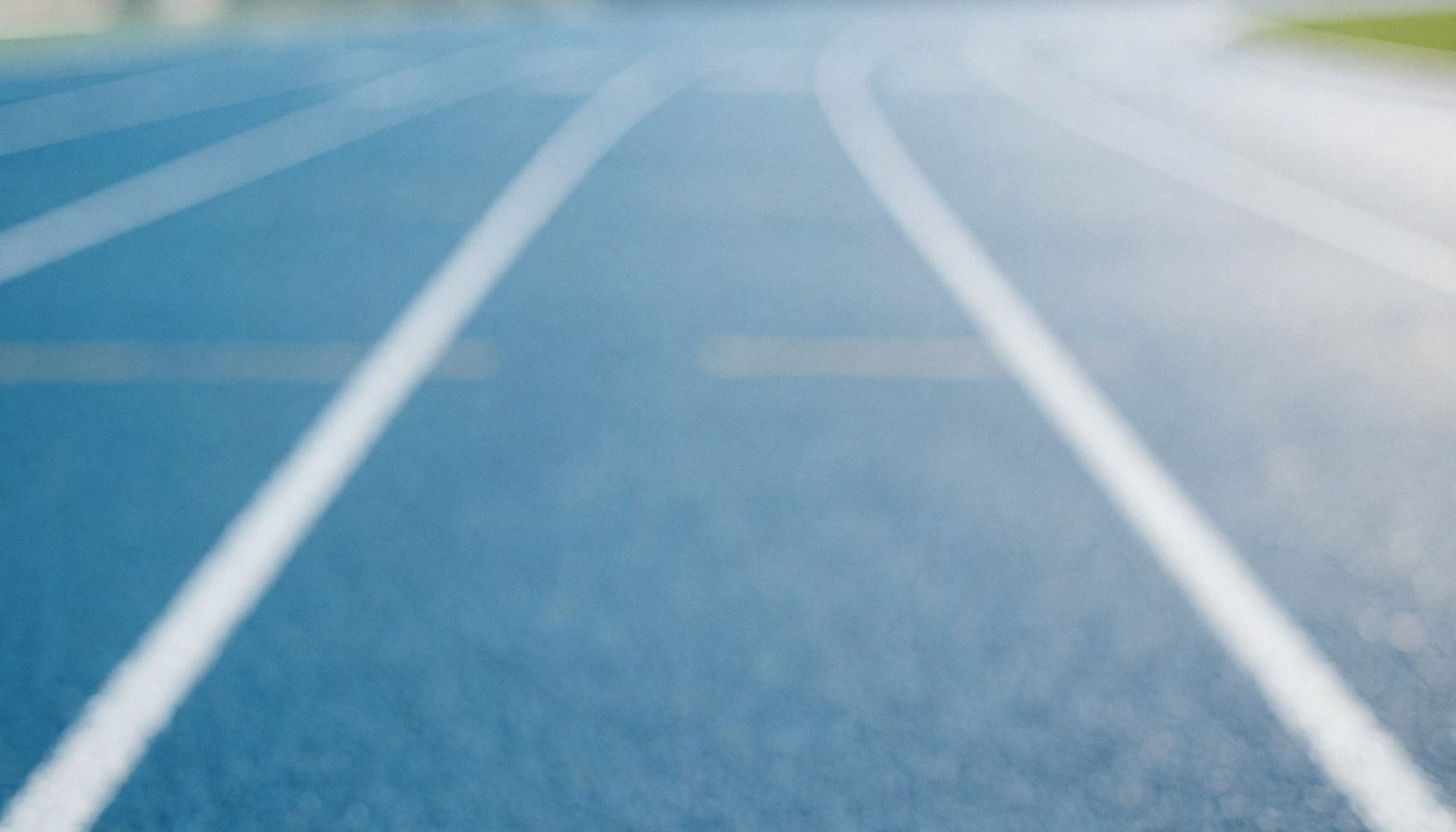 Fond de piste d'athlétisme synthétique bleue avec des marques blanches, idéal pour les textes des entraîneurs d'athlétisme.